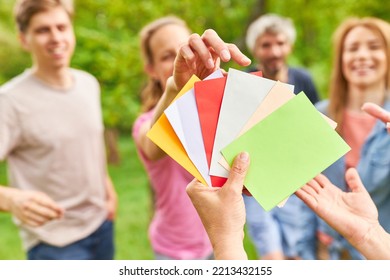 Young People Draw Colorful Cards To Get To Know Each Other In The Outdoor Team Building