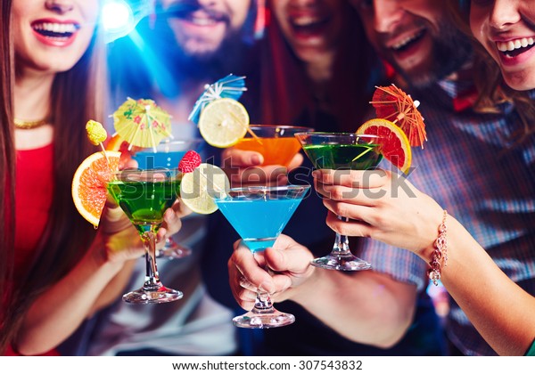 Young people\
drinking cocktails at\
nightclub