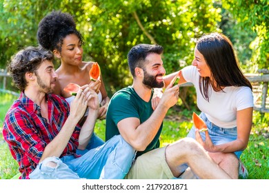 Young People Eating Watermelon In Park – Happy Friends Eating Watermelon In A Park Party – Happy Young Friends Eating Cucumber