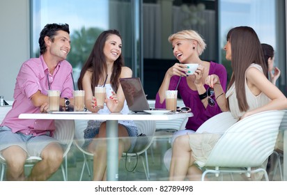 Young people enjoying coffee break - Powered by Shutterstock