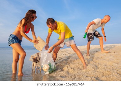 Young People Friends Picking Up Trash And Garbage On Tropical Beach Saving Planet And Ecology In Indonesia, Thailand And Philippines