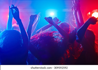 Young people getting more and more uninhibited dancing - Shutterstock ID 309592592
