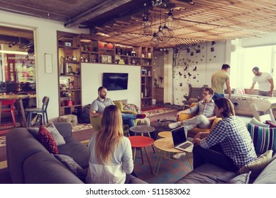 young people group in modern office have team meeting and brainstorming while working on laptop and drinking coffee - Shutterstock ID 511583062