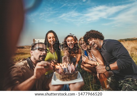 Similar – Man with piece of cake in a summer barbecue