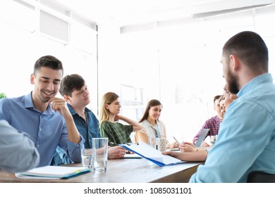 Young people having business training in office - Shutterstock ID 1085031101