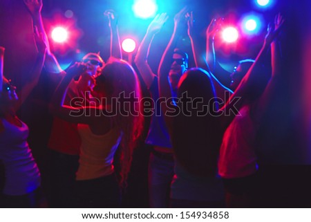 Young people having fun dancing at party.