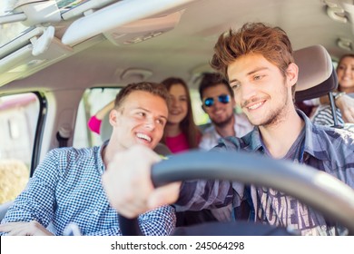 Young People Having Vacation Enjoying Fun Driving Car