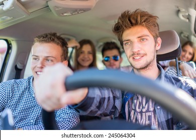 Young People Having Vacation Enjoying Fun Driving Car