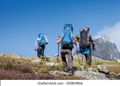 Young People Are Hiking In Highlands Of Altai Mountains, Russia