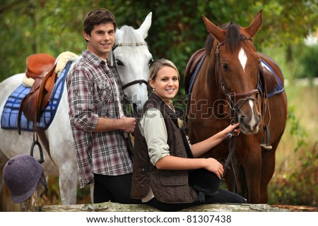 Young people horseriding