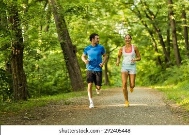 Young People Jogging And Exercising In Nature