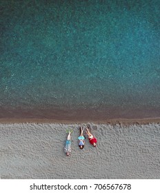 Young People Lying On The Beach, Aerial Drone Shot