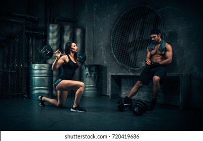 Young People Making Functional Training In The Grungy Gym