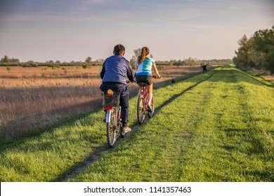 Young people on a bicycle during a bicycle tour, embankment  over the Vistula river bank near Karczew and Otwock - Powered by Shutterstock