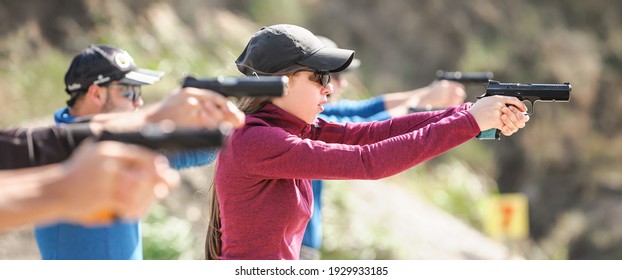 Young People On Tactical Gun Training Classes. Shooting And Weapons. Outdoor Shooting Range