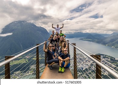 Young people on the top of mountain, Alesund, Norway