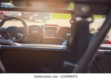 Young People On UTV Vehicles On A Countryside Trail. View From A UTV Vehicle With Man Driving An UTV On A Sunny Day.