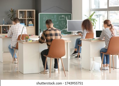 Young people at physics lesson in classroom - Shutterstock ID 1743955751