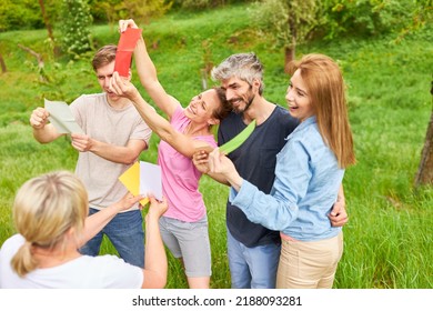 Young People Read Colorful Cards To Get To Know Each Other In The Team Building Outdoor Workshop