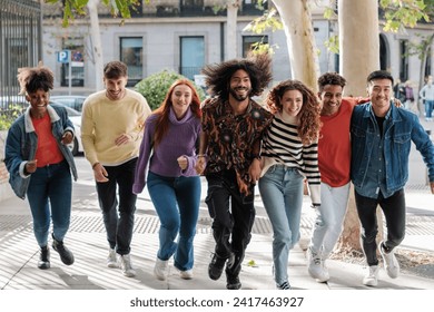 Young people running outdoors and smiling funny. Concept: lifestyle, together. - Powered by Shutterstock