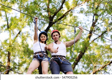 young people in safety equipment are obstacles on the road rope - Powered by Shutterstock