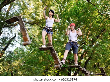 young people in safety equipment are obstacles on the road rope - Powered by Shutterstock