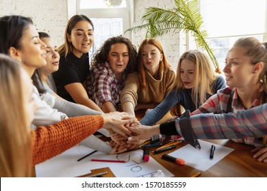 Young people shaking hands while discussing of women rights and equality at the office. Caucasian businesswomen or office workers have meeting about problem in workplace, male pressure and harassment. - Shutterstock ID 1570185559