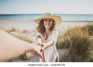 Young people sharing happy  and love mood on the beach. Couple in love get in connection with tuscan nature - Powered by Shutterstock