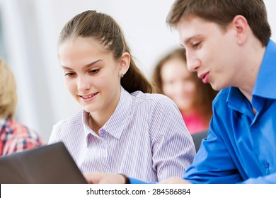 Young people sitting in classroom at lecture