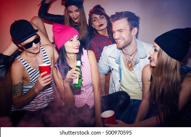 Young People In Smoky Dark Club