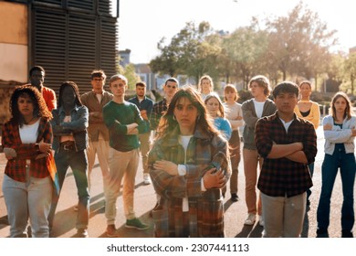 young people standing strong in picket protest during a demonstration - Powered by Shutterstock