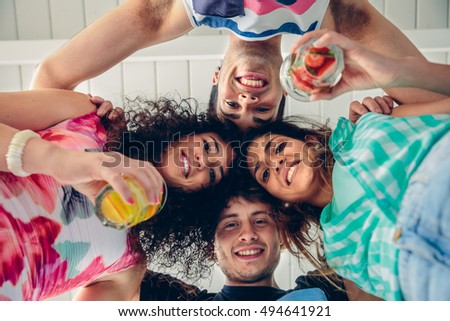 Similar – Young people with their heads together having fun