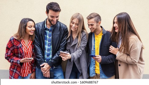 Young People Using Smartphones - Group Of Social Media Co Workers Having Fun With Online Video Photo - Technology Obsession 