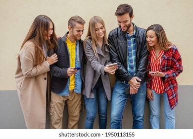 Young People Using Smartphones - Group Of Social Media Co Workers Having Fun With Online Video Photo - Technology Obsession