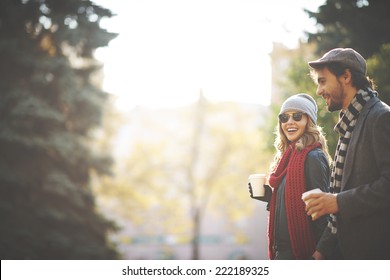 Young people walking in autumn - Shutterstock ID 222189325
