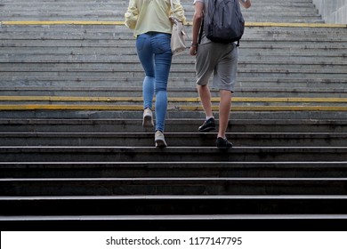 Young People Walking Up The Stairs