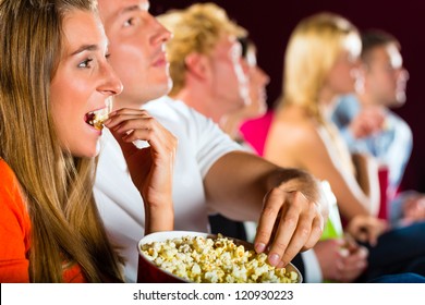 Young People Watching Movie At Movie Theater