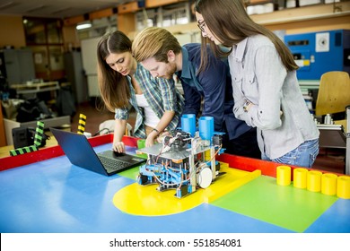 Young people working in the robotics classroom