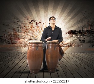 Young percussionist playing with his instrument - Powered by Shutterstock