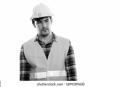 Young Persian Man Construction Worker Thinking While Looking Sad