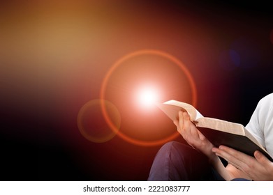 Young Person Holding Bible Book