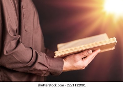 Young Person Holding Bible Book