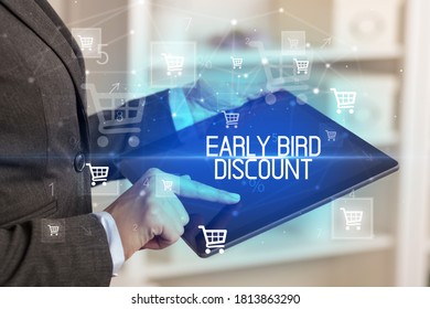 Young Person Makes A Purchase Through Online Shopping Application With EARLY BIRD DISCOUNT Inscription