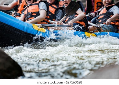 Young person rafting on the river, extreme and fun sport at tourist attraction