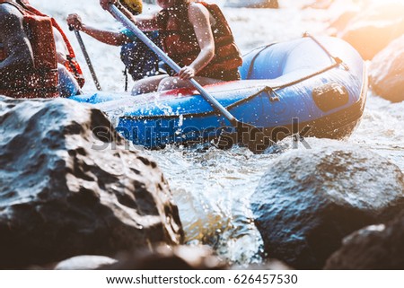Young person rafting on the river, extreme and fun sport at tourist attraction