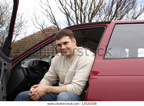 young person with red
car