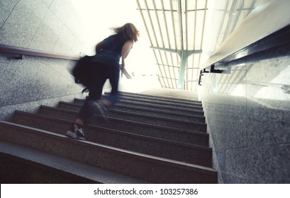 Young Person Running Up The Stairs