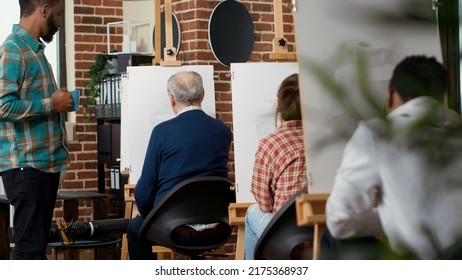 Young Person Talking To Elder Man About Vase Drawing, Teaching Artistic Skills In Educational Workshop. Attending Art Class Program To Learn To Draw Artwork On Canvas, Creative Practice.