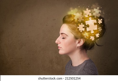 Young Person Thinking With Glowing Puzzle Mind On Grungy Background