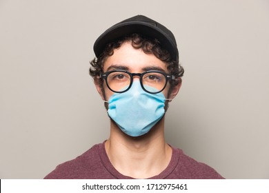 Young Person Wearing A Face Mask Hat And Glasses